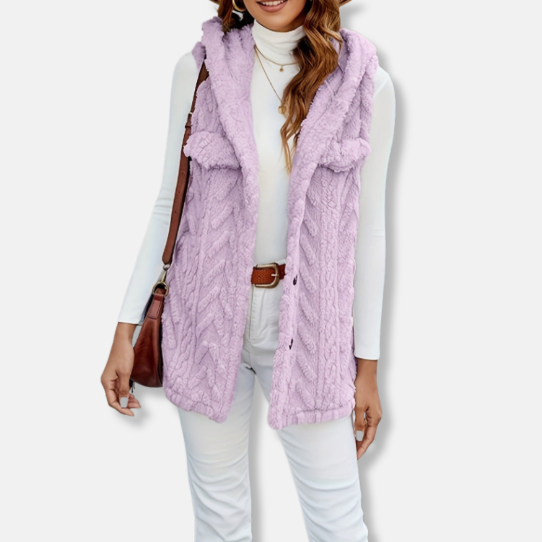 Women's cable knit hooded vest in cozy fuzzy texture with relaxed fit and functional pockets