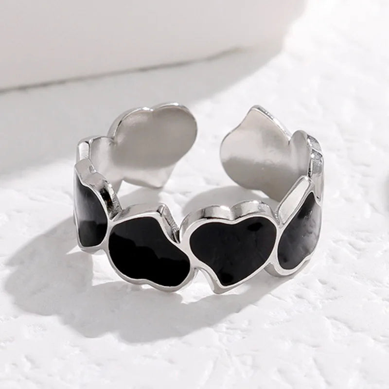Adjustable stainless steel heart link ring with glossy enamel hearts in pearl white or jet black