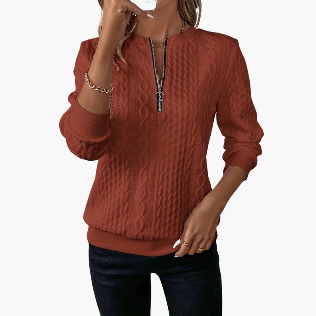 Women's cable knit pullover sweater with front zip neckline, long sleeves, and ribbed cuffs classic fit