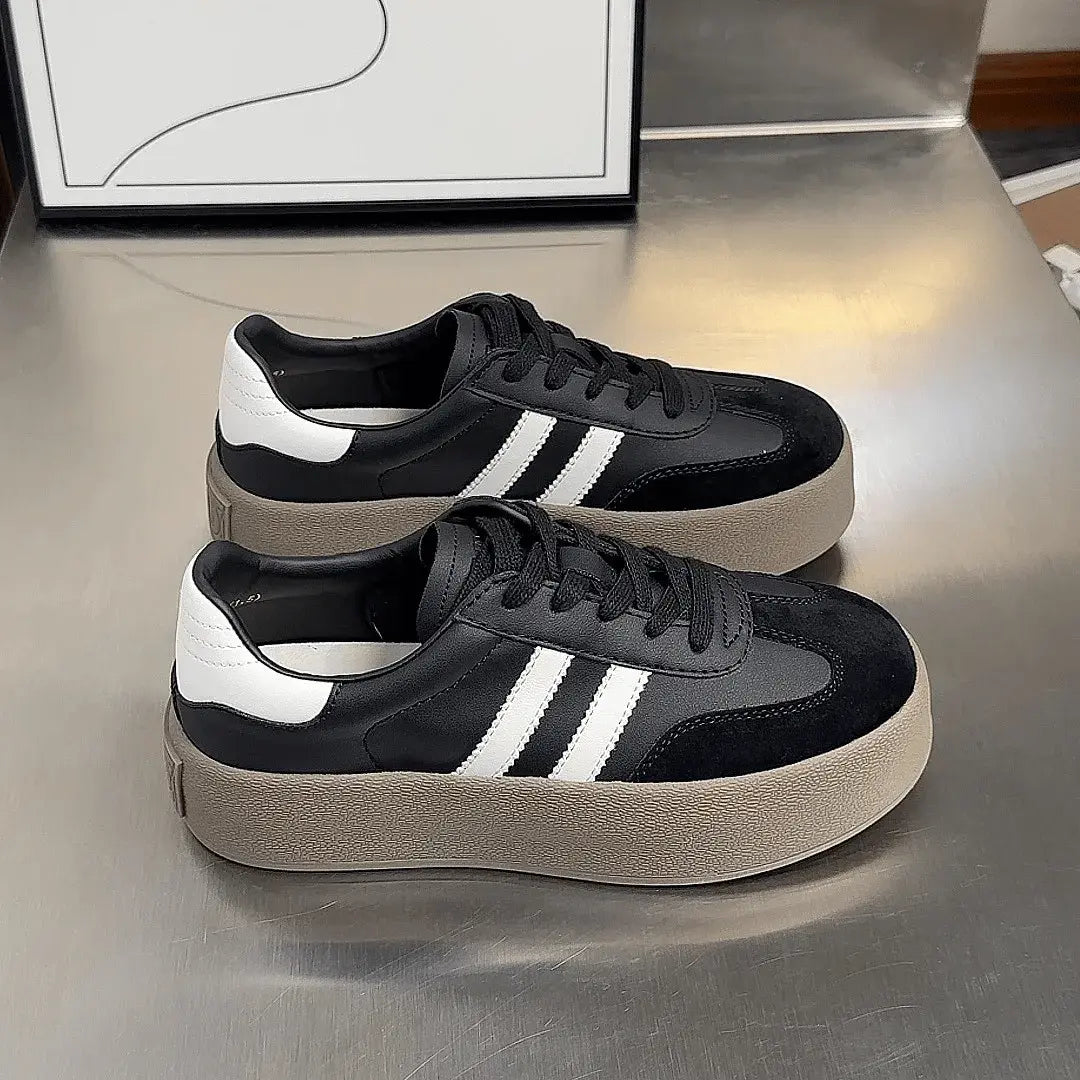 Women's white chunky sole sneakers with minimalist design and bold platform for urban street style