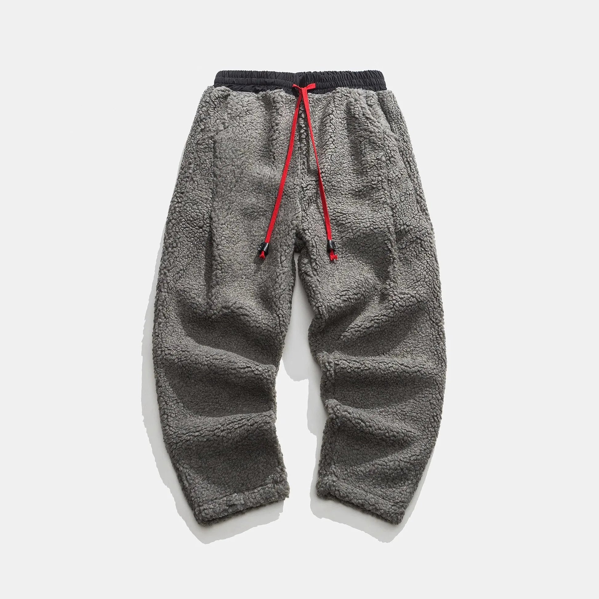 Tapered sherpa fleece jogger pants with deep pockets, ultra-soft textured finish for cold weather comfort