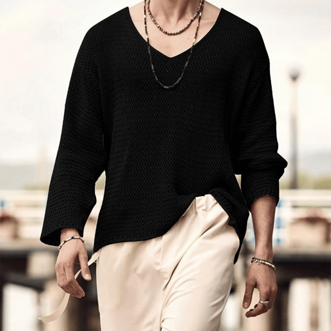 Men's relaxed knit sweater with deep V-neckline, breathable drape and versatile everyday style