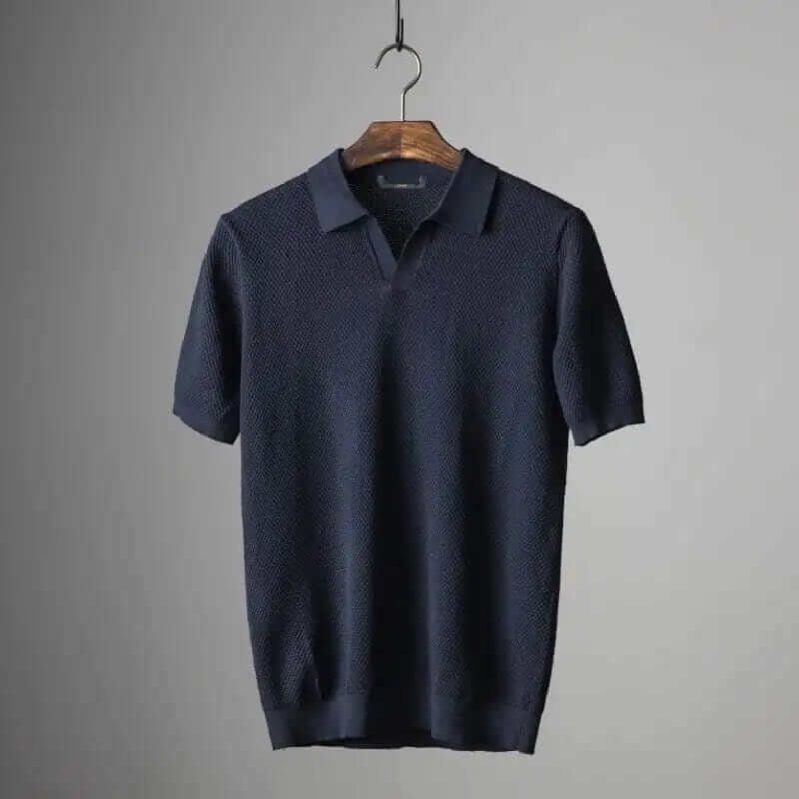 Men's navy waffle knit polo shirt, stretch cotton blend with tailored fit and textured pattern