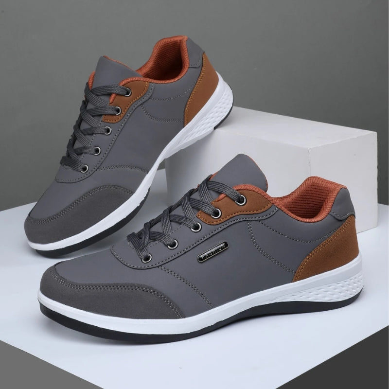 White leather lace-up casual sneakers with contrasting brown accents, clean silhouette for city commuting