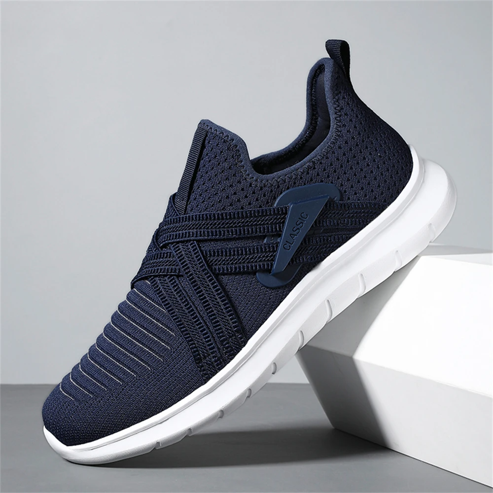 Gray slip-on walking sneakers with shock-absorbing sole, wide toe box, and padded heel collar
