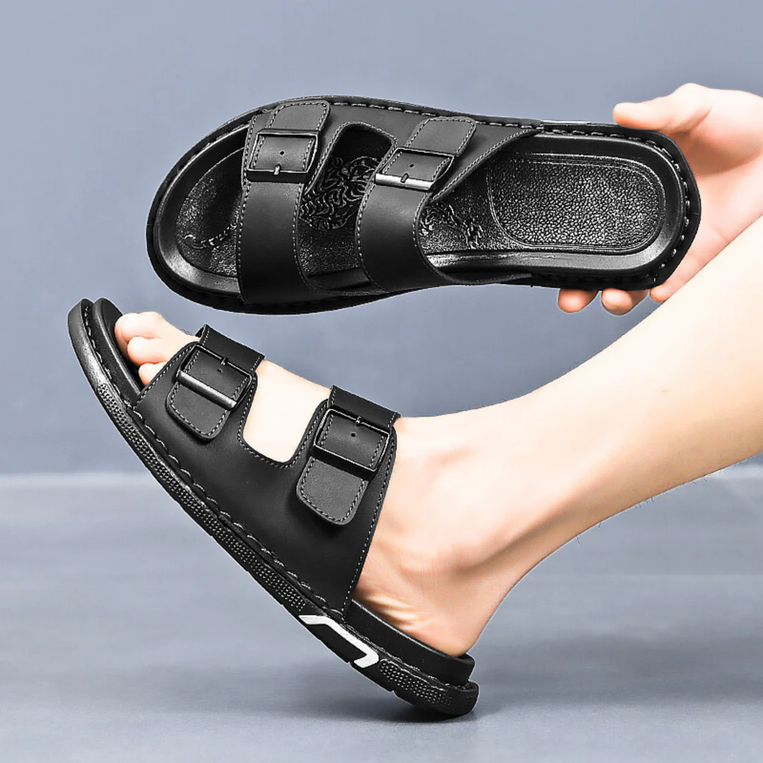 Brown leather double strap sandals with cushioned insole, adjustable buckles, and durable stitched sole
