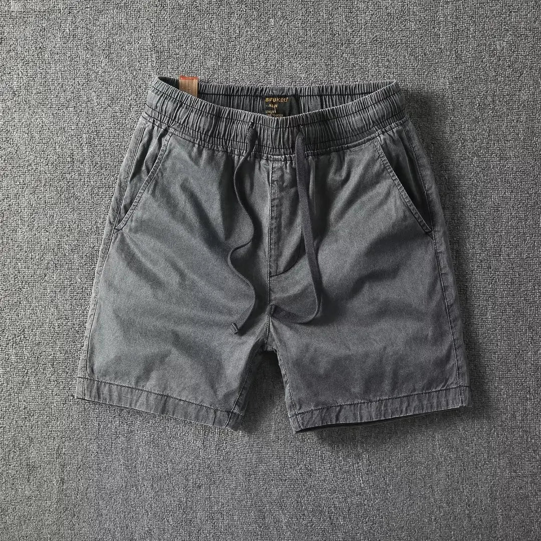 Men's washed cotton relaxed-fit shorts with elastic drawstring waist and deep pockets, vintage style