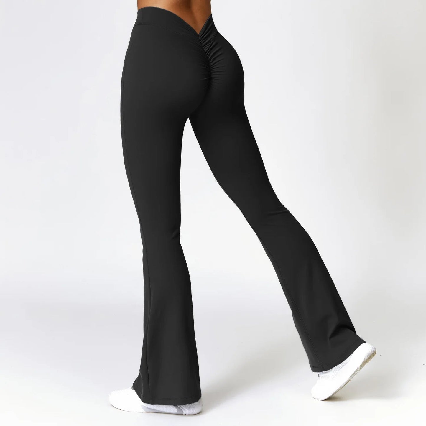 Black high-waisted flare yoga pants with premium nylon spandex stretch fabric for studio-to-street wear