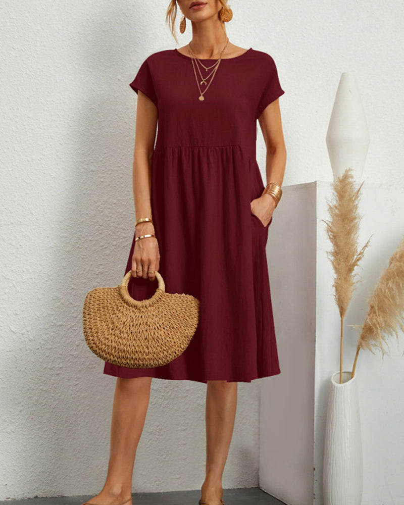 Women's round neck midi dress with pockets, versatile everyday style in polished silhouette