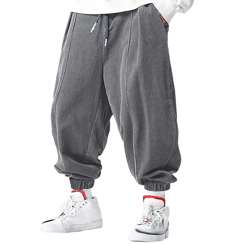 Beige wide-rib corduroy harem jogger with oversized patch pockets, ultra-soft streetwear fit