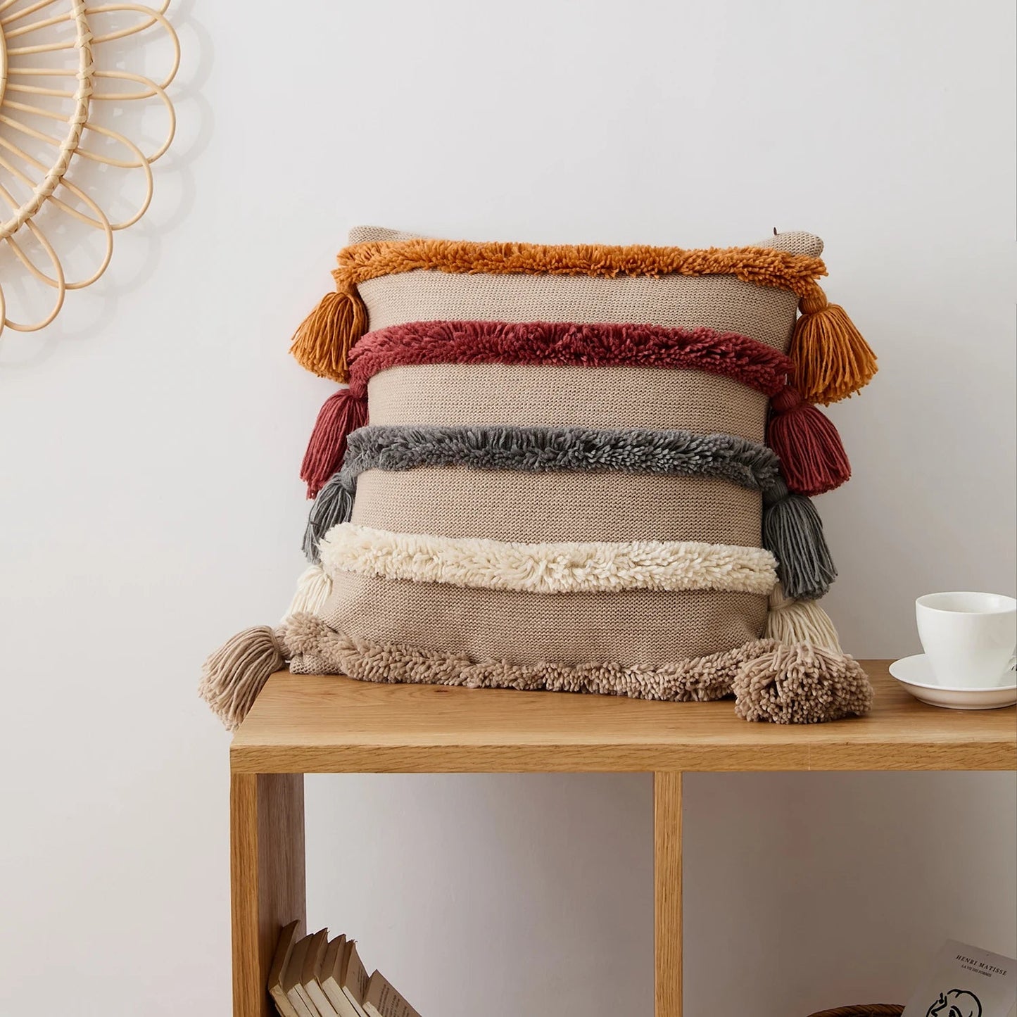 Boho tufted cushion cover with hand-tied tassels and bold pattern for sofa or bed decor