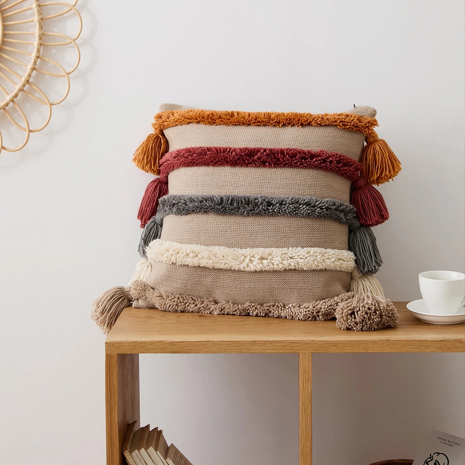 Boho tufted cushion cover with hand-tied tassels and bold pattern for sofa or bed decor