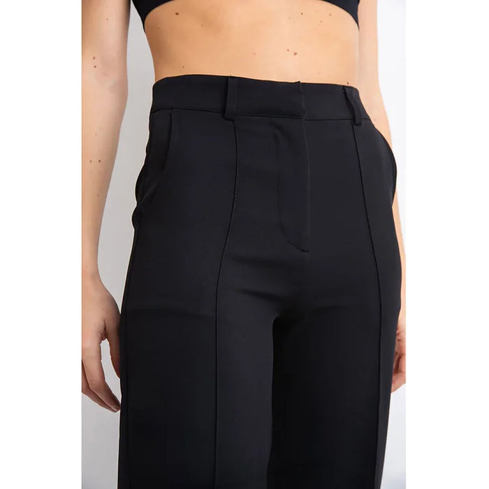 Women's high-waisted wide-leg suit pants with deep pockets, elegant office-to-party style