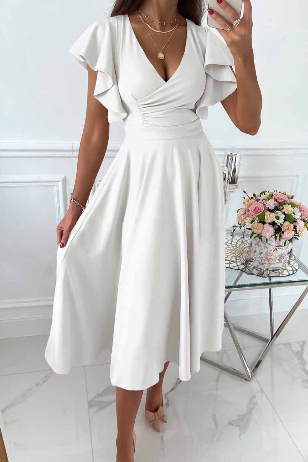 Women's burgundy wrap dress with V-neck and ruffle sleeves, feminine silhouette