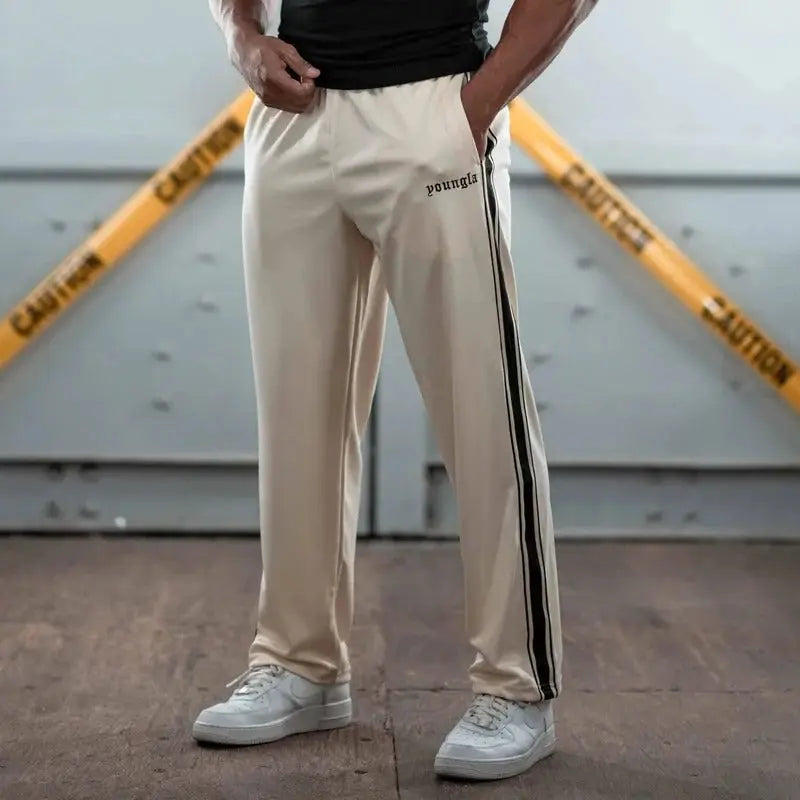 Black urban sweatpants bold side stripe elastic waistband soft fabric relaxed fit everyday athletic style