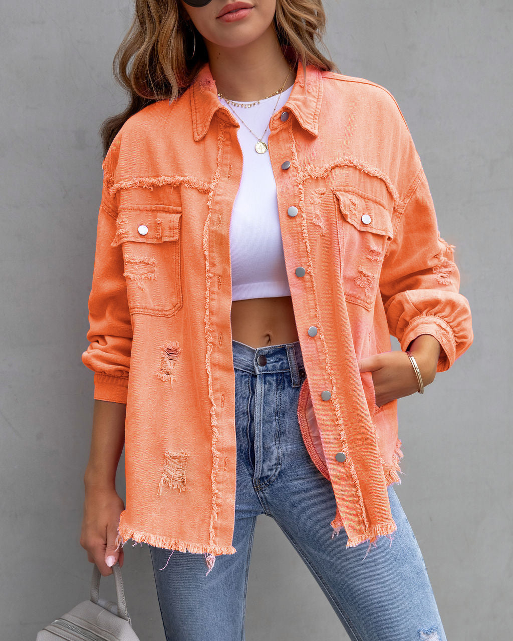 Women's relaxed shirt jacket in neutral tones with chic urban style and distressed detailing