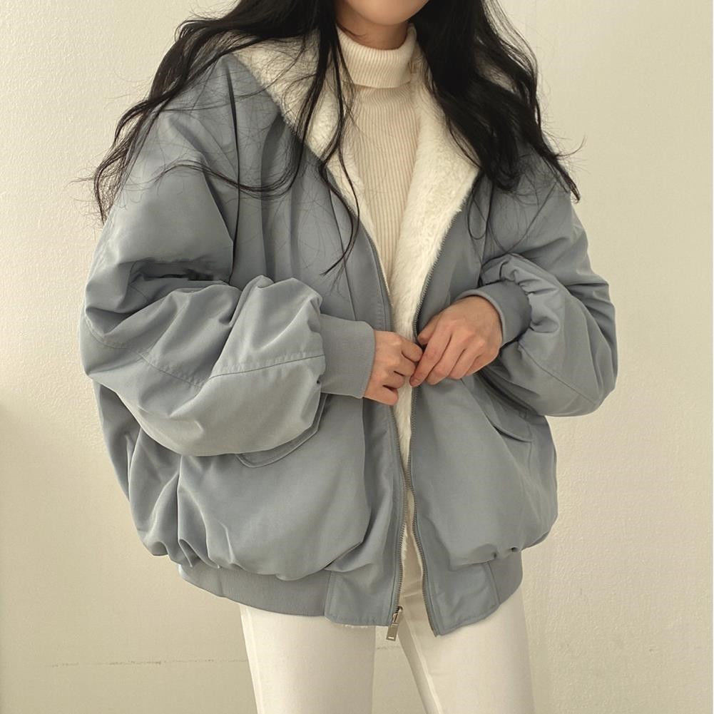Oversized fluffy bomber jacket with faux shearling lining, dropped shoulders, relaxed winter style