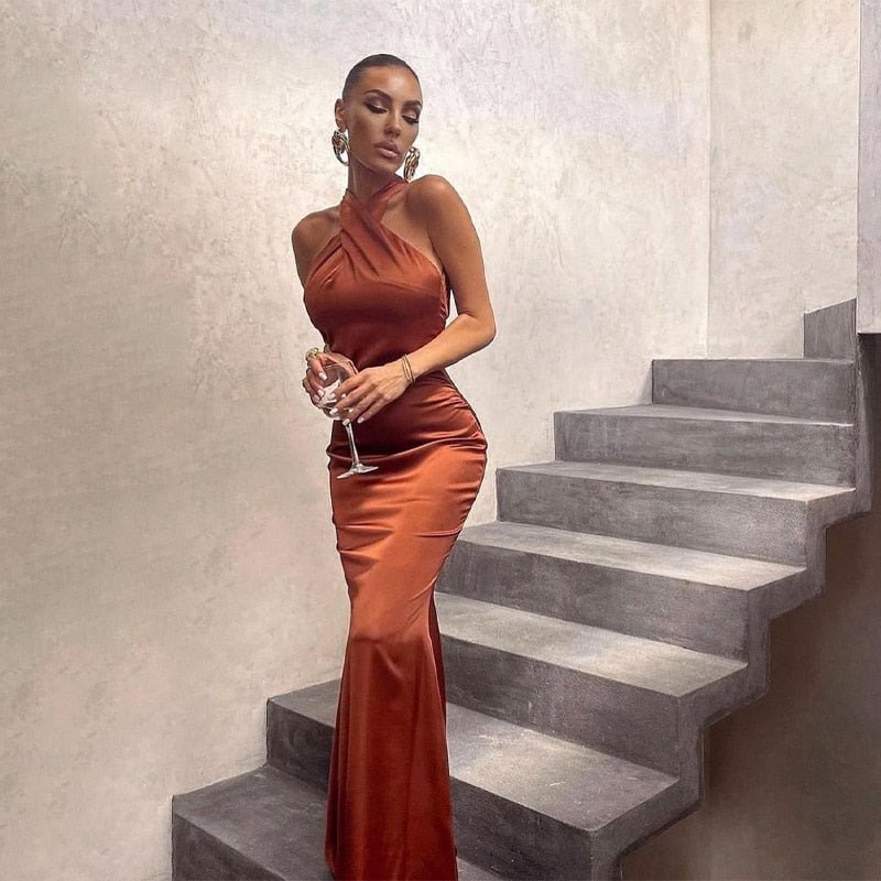 Women's black sleeveless long evening dress with elegant high collar and fluid silhouette