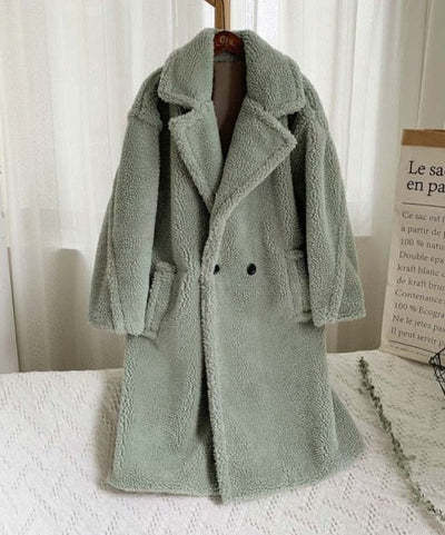 Women's ivory faux fur coat with lapel collar, cozy plush texture, and functional side pockets