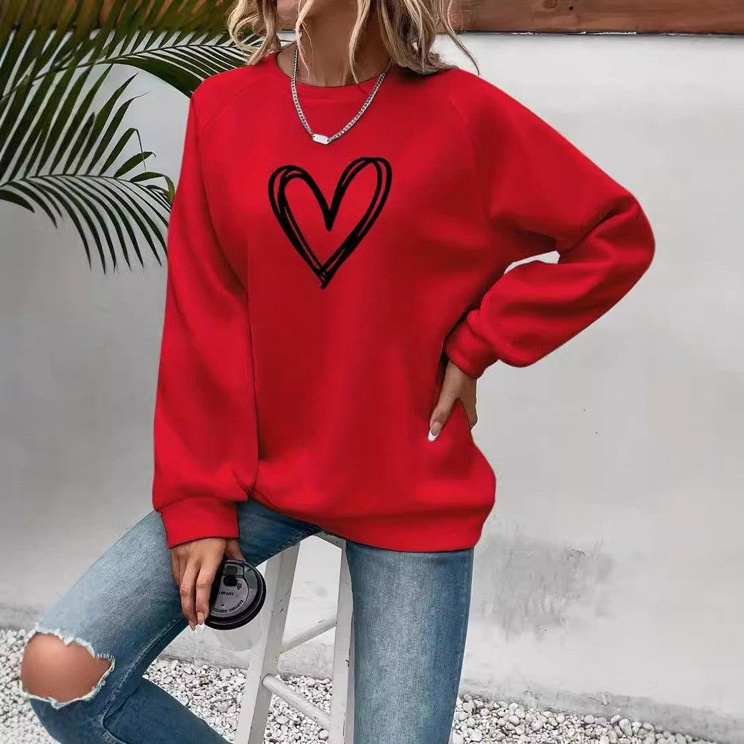Women's pink heart print crew neck sweatshirt, long sleeve cozy everyday pullover with cute motif
