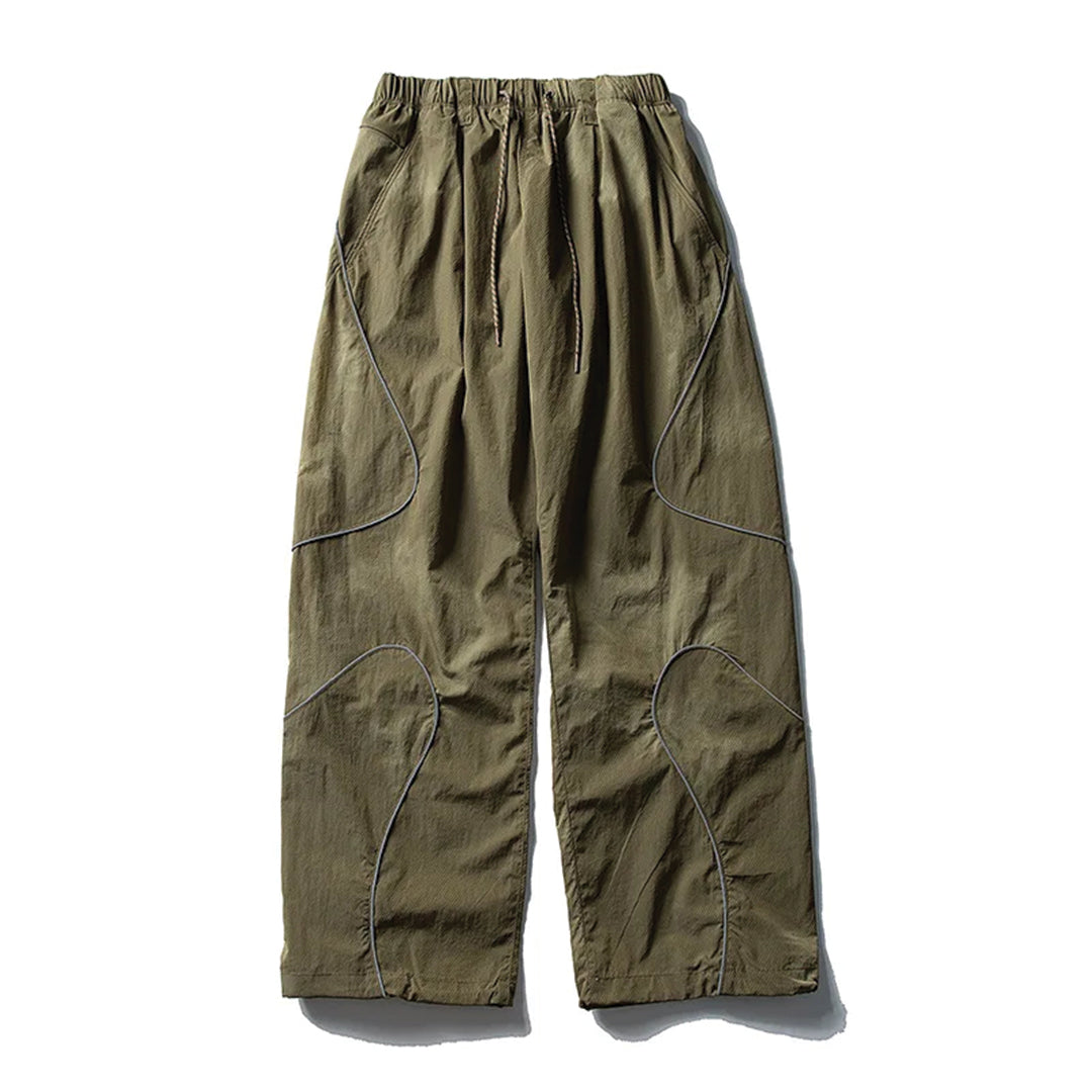 Black quick-dry nylon running trousers with curved reflective stripes and drawstring waist
