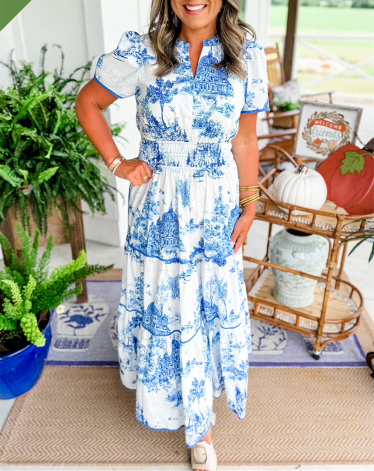 Women's printed button-front maxi dress with artistic illustration print and defined waist silhouette