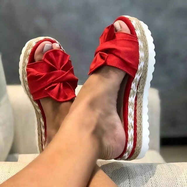 Women's woven upper sandals with bow detail, open toe design, and supportive sole for all-day comfort