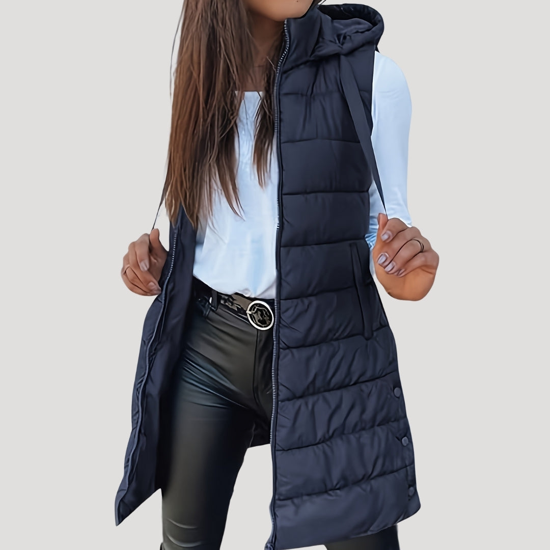 Women's lightweight hooded puffer vest in neutral tone, sleeveless quilted insulation for winter layering