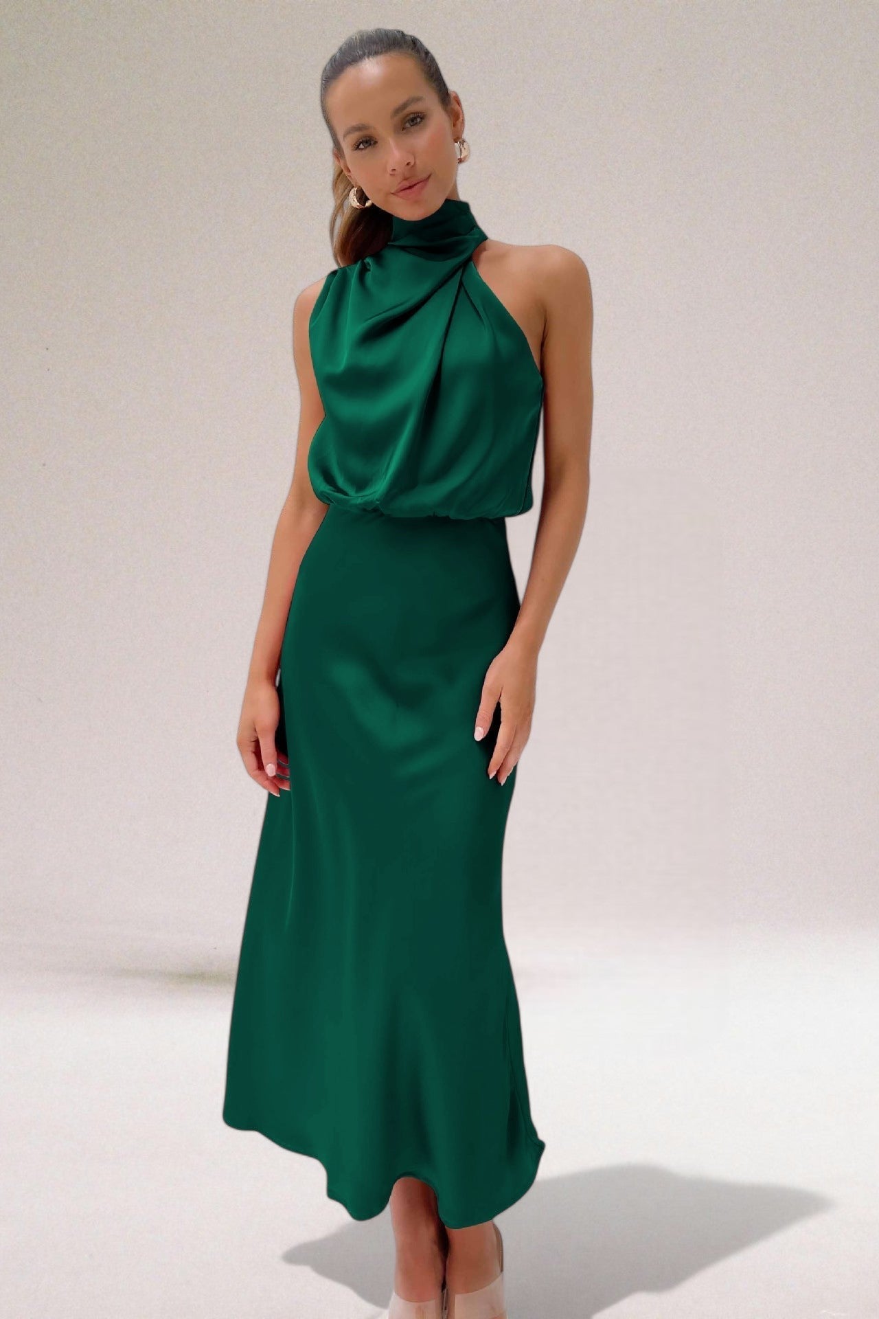 Women's ivory satin halter dress with elegant figure-flattering silhouette and luxurious subtle sheen