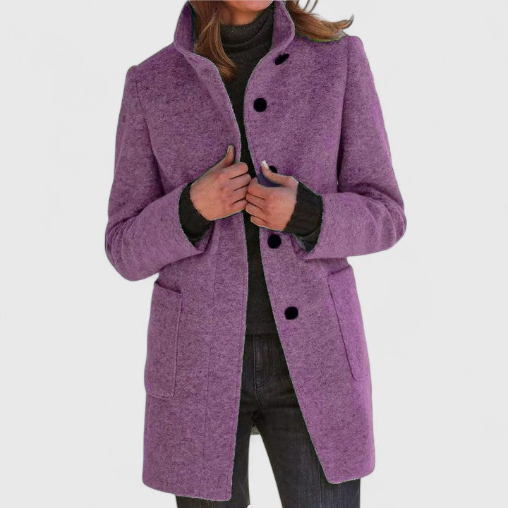Women's mid-length structured coat in elegant neutral tone with polished tailored silhouette for daily wear