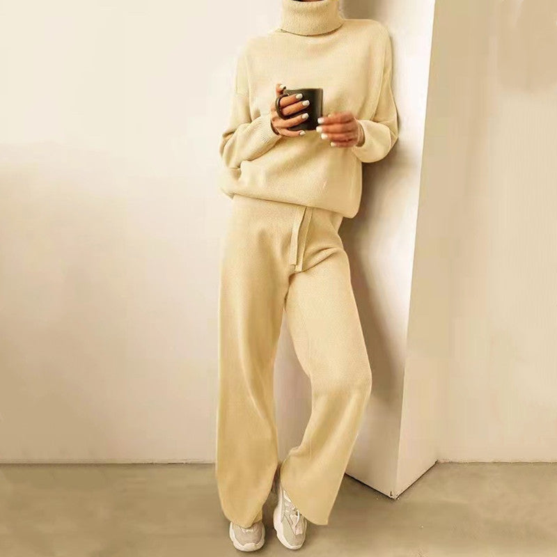 Women ivory knit two-piece set with loose turtleneck and wide-leg pants featuring waist tie