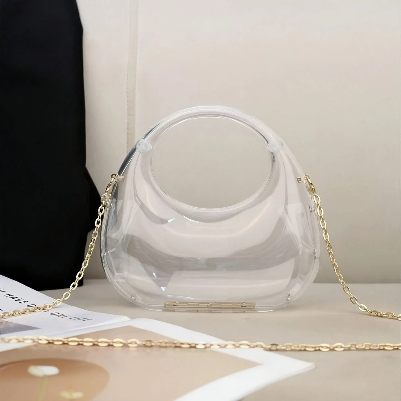 Nova sculptural clutch bag mirror-gloss finish sculpted silhouette high-shine acrylic wedding evening bag