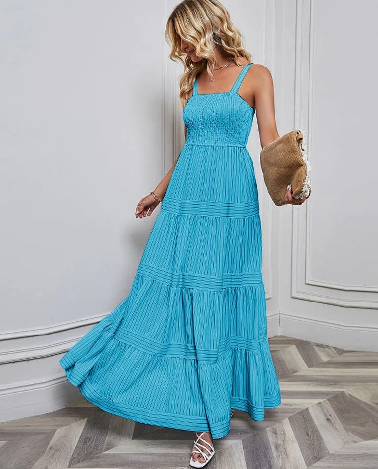 Elegant women's maxi dress smocked bodice flowy A-line silhouette light feminine summer style