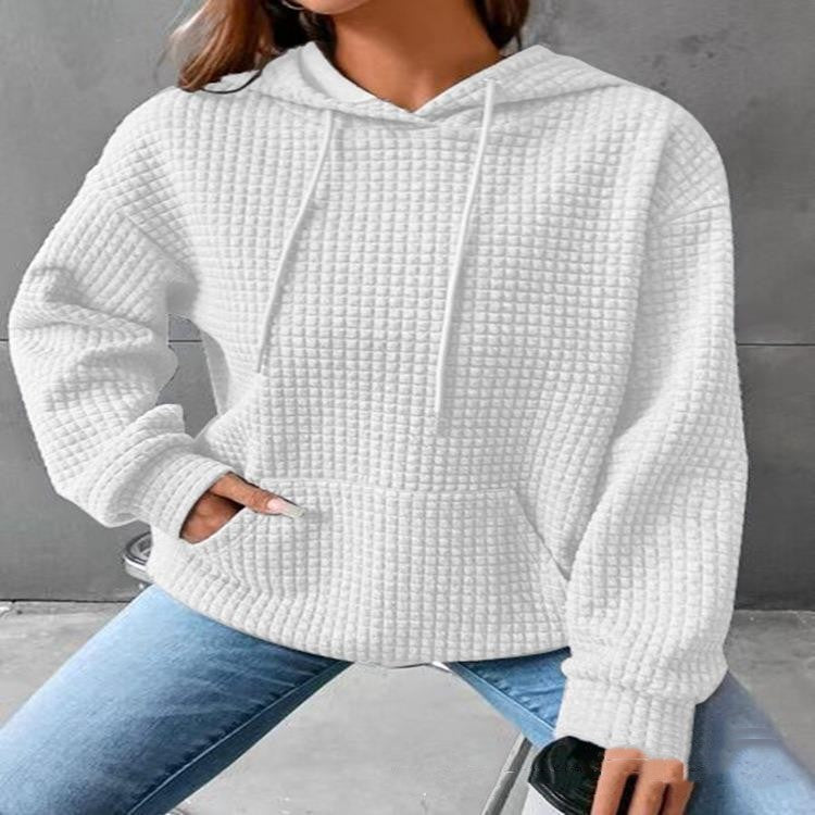 Women's loose fit hoodie with kangaroo pocket in soft textured fabric for casual everyday comfort