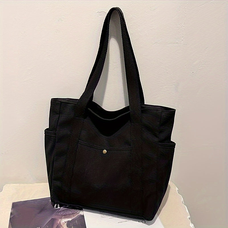Women's minimalist shoulder bag with secure zipper, long straps, and spacious interior for everyday use