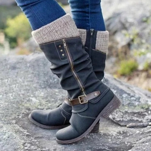 Women's knee-high boots with buckle detail, knit cuff, textured sole, and side zipper closure