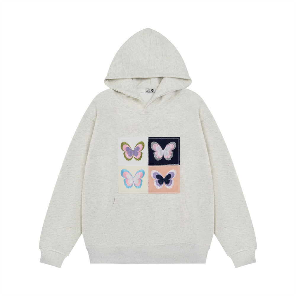 Women's cozy hoodie with embroidered butterfly patch, casual streetwear style in soft fabric