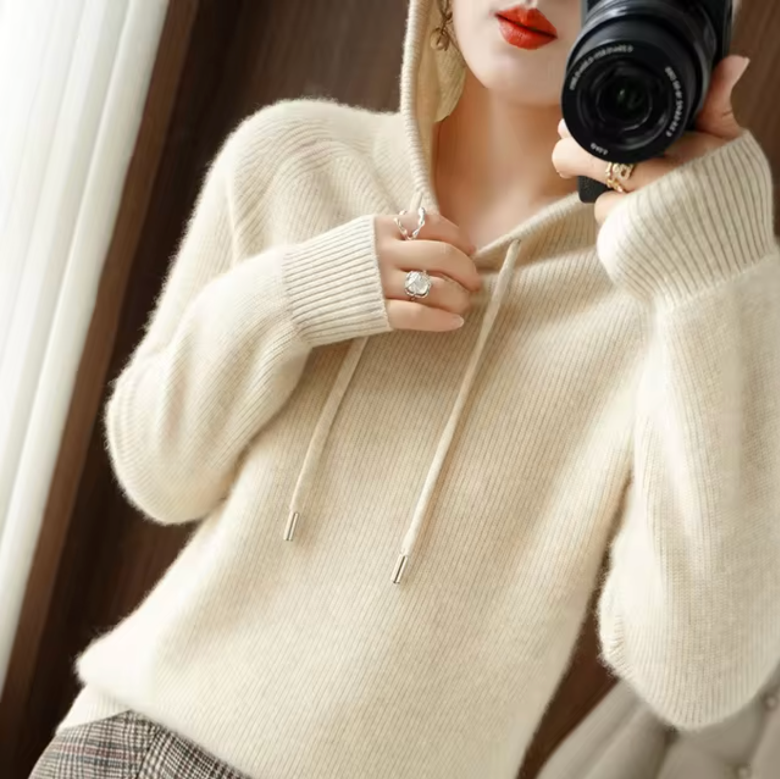 Women's minimalist knit hoodie with adjustable hood, long sleeves, cozy layering essential for everyday wear