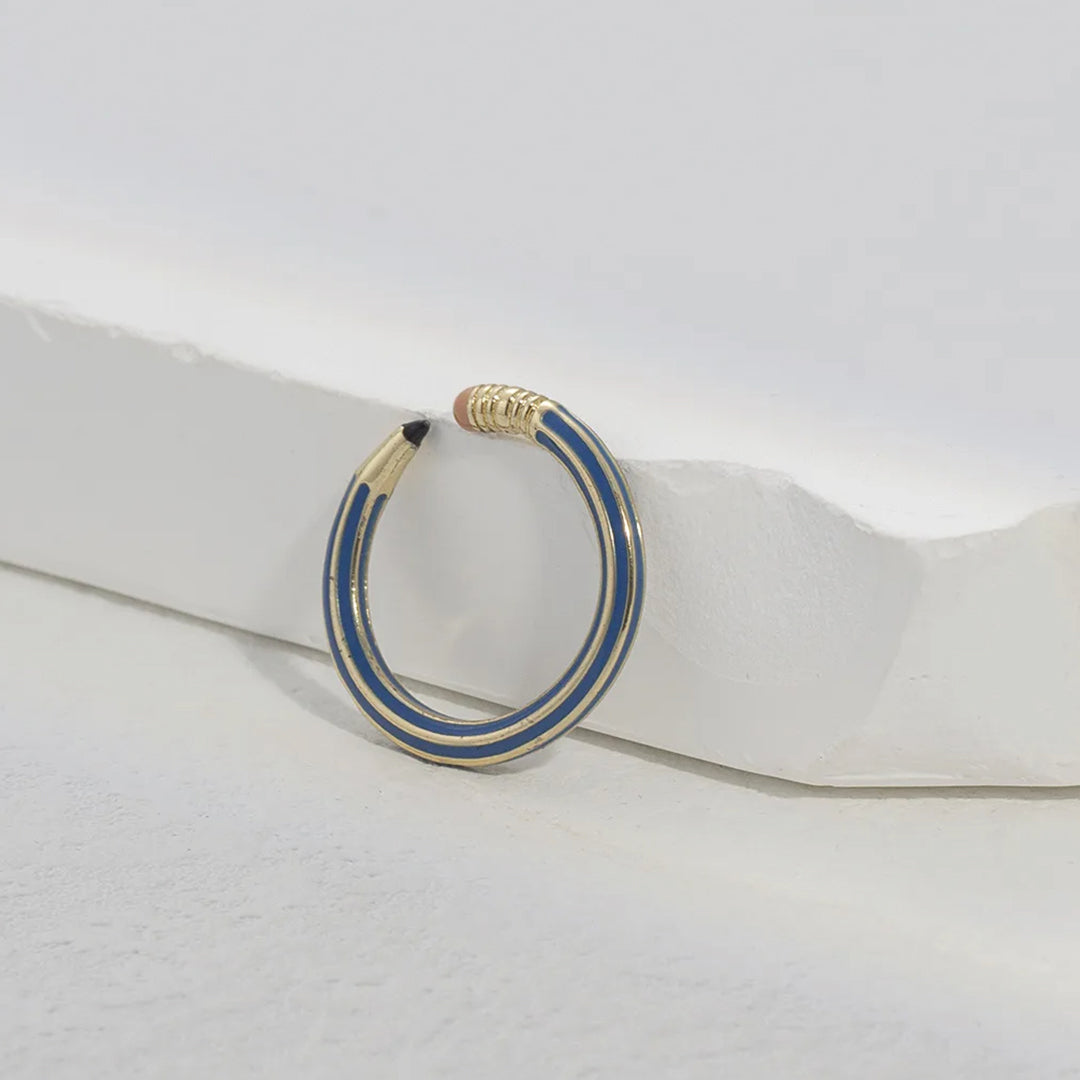 Rose gold adjustable copper pencil-shaped statement ring with playful stationery-inspired silhouette