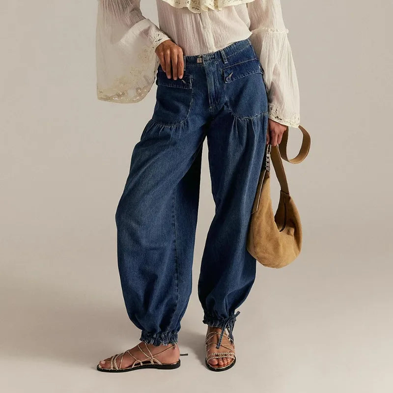 Women's wide-leg denim harem jogger in soft blue with high-rise fit and adjustable drawcord hem
