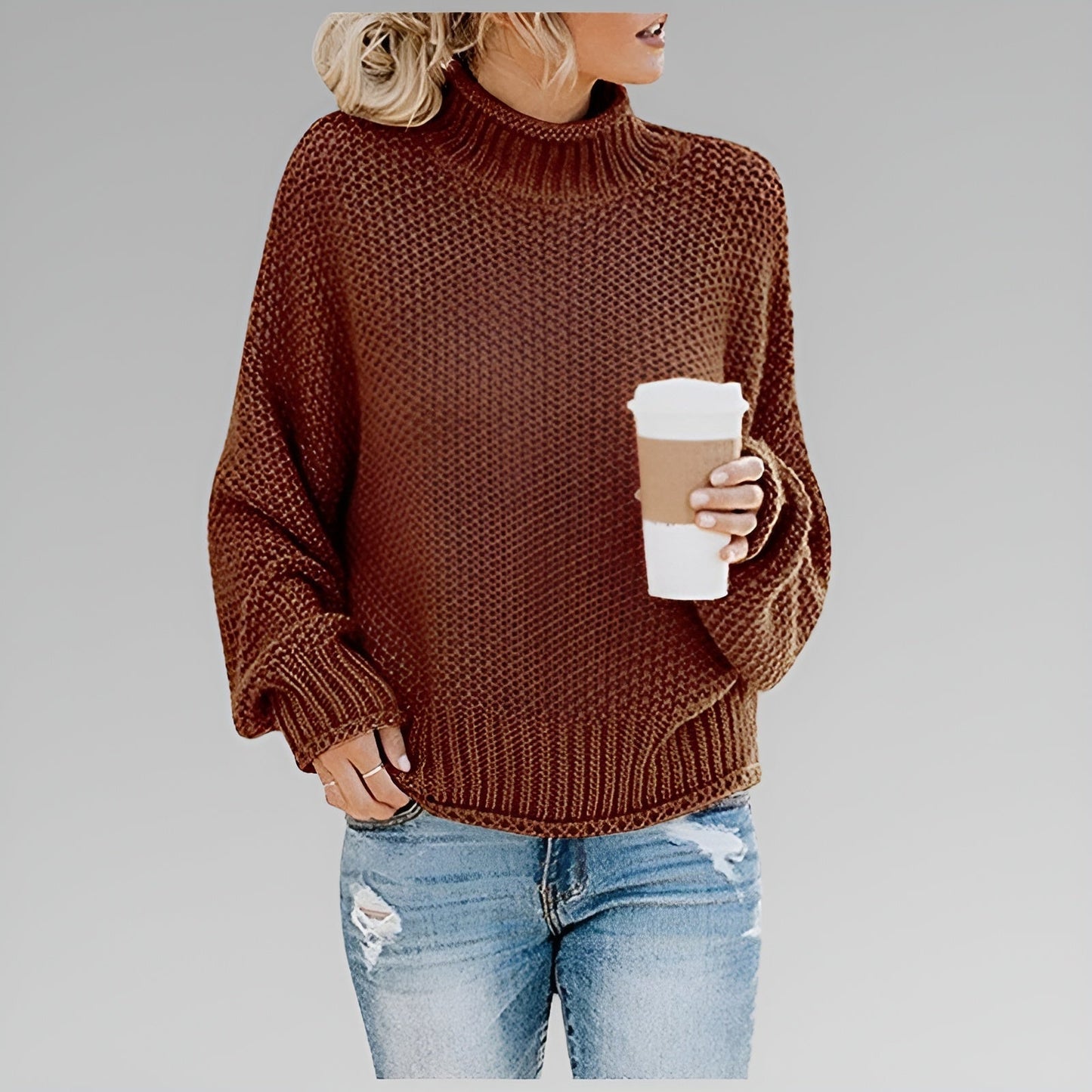 Women's oversized chunky knit sweater in neutral tones, relaxed fit with cozy textured weave