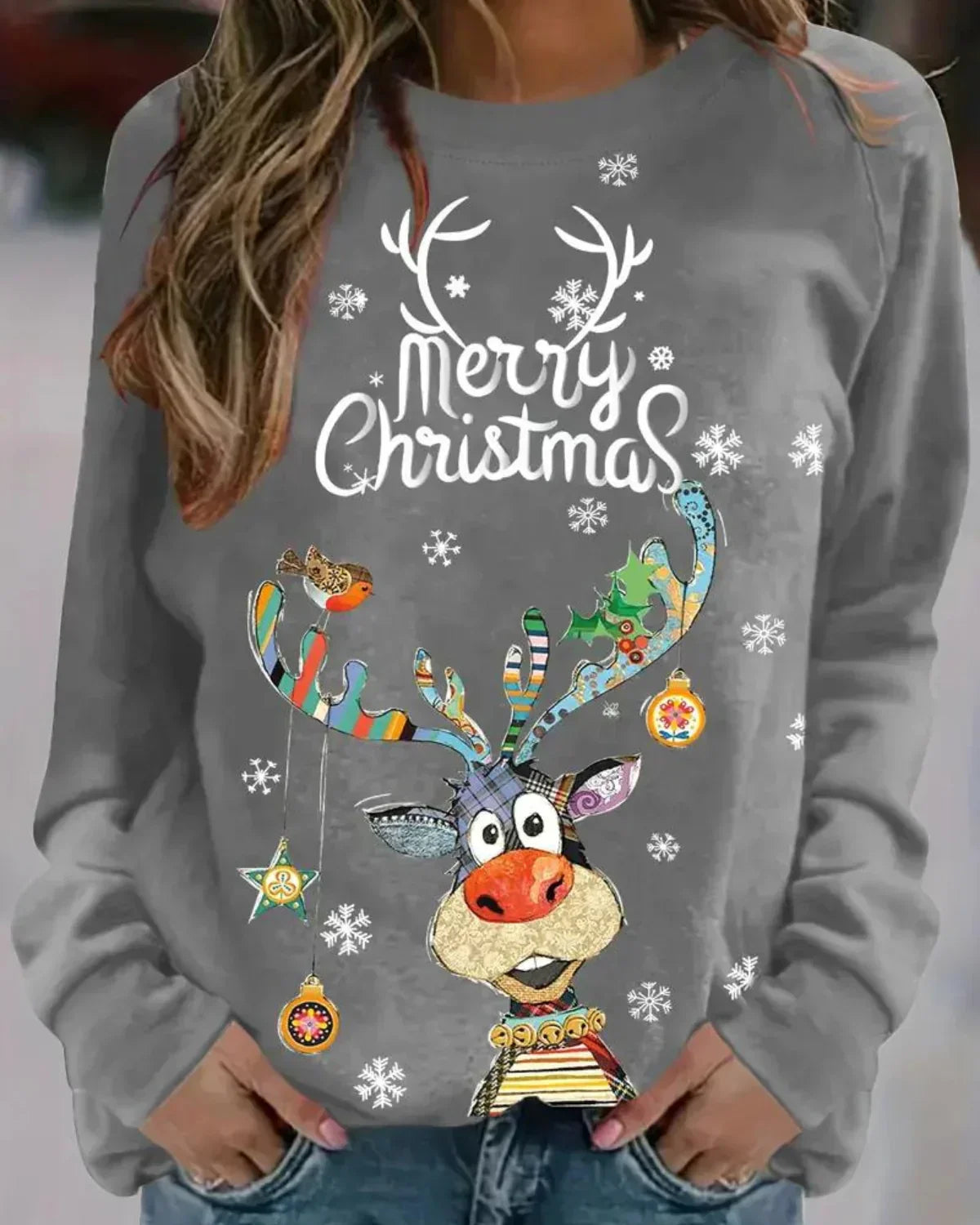 Cozy Christmas knit sweater in festive colors with cheerful reindeer motif for holiday winter style
