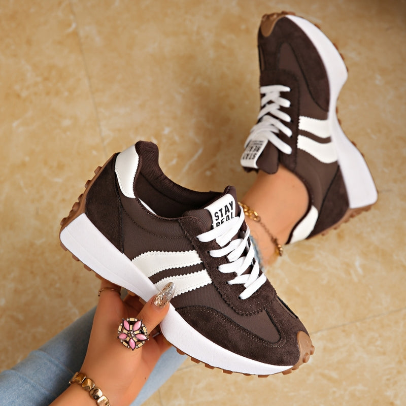 Women's white platform lace-up sneakers with chic side stripe detail and trendy height-boosting sole