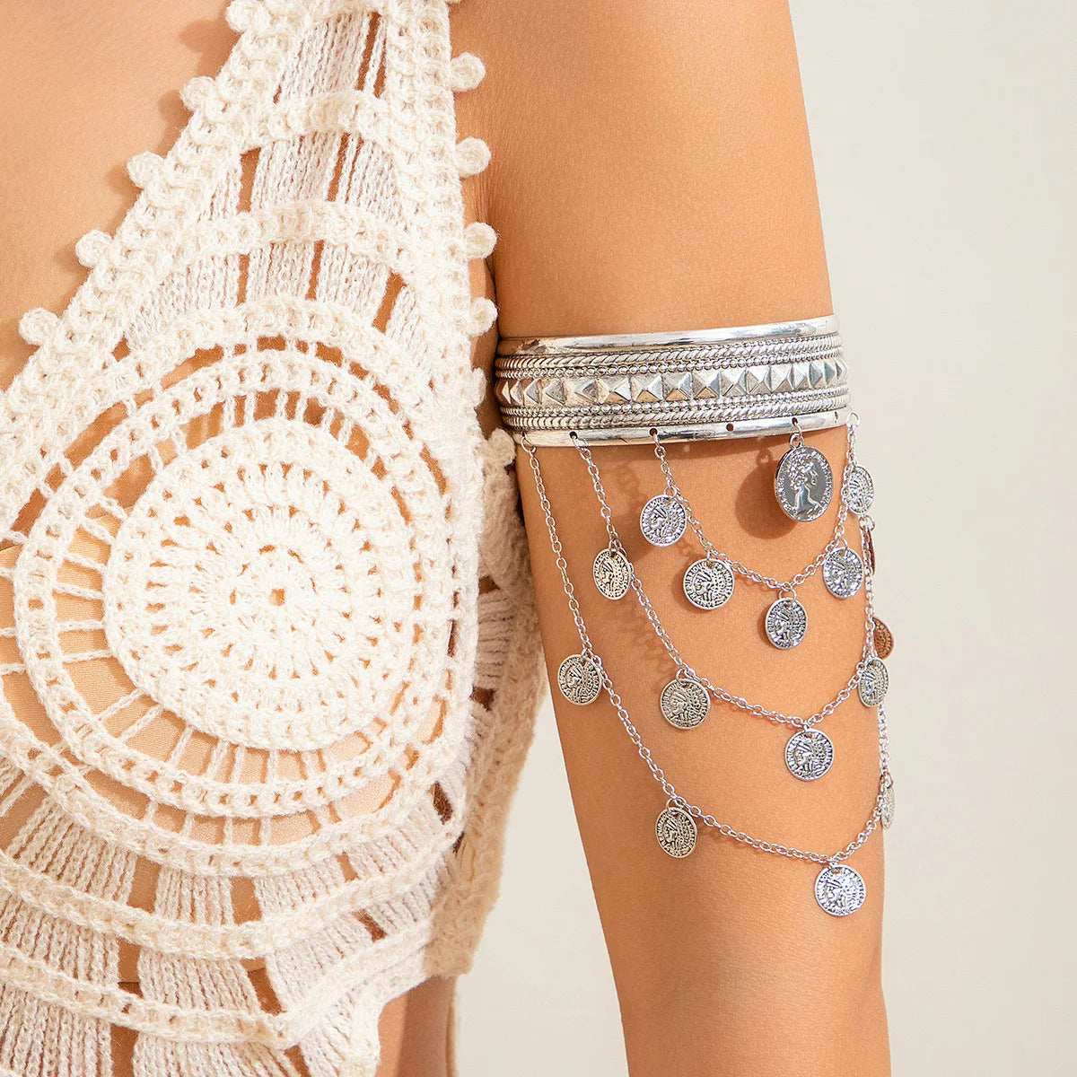 Gold armlet cuff bangle with layered chains, pyramid studs, and tarnish-resistant sculptural finish