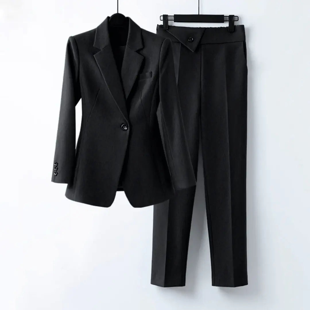 Women's navy blue two-piece blazer suit precision-fit tailored silhouette for executive boardroom style