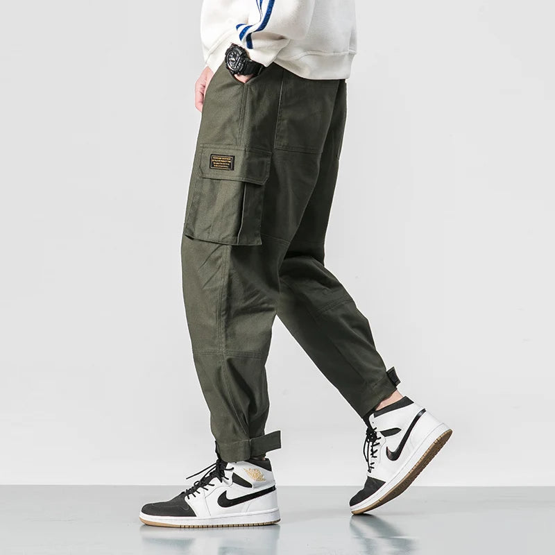 Phoenix black tapered cargo jogger pants with deep side pockets and adjustable streetwear fit