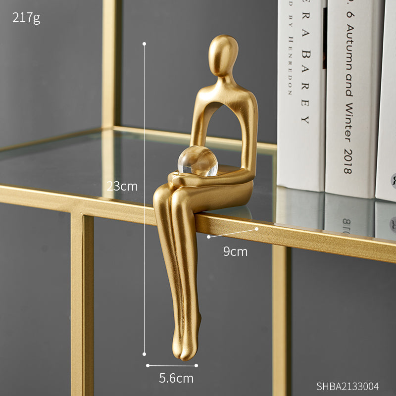 Abstract gold-tone resin statue seated human form minimalist modern decor sculpture for desk or shelf