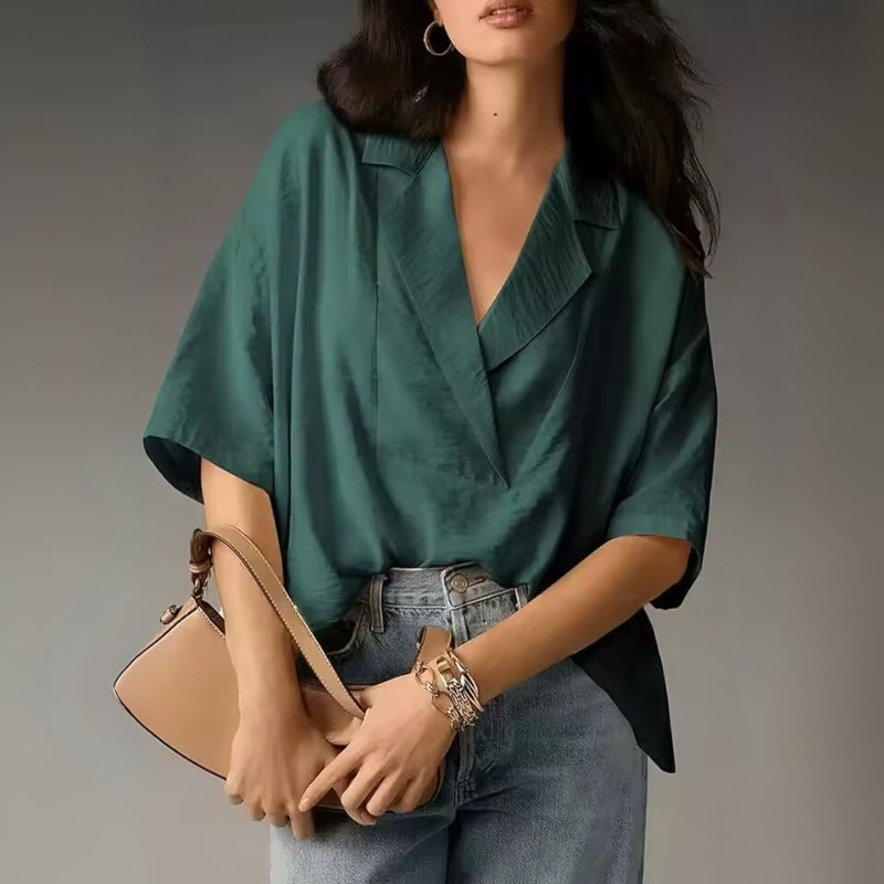 White relaxed-fit women's summer blouse with clean front overlap and lightweight breathable fabric