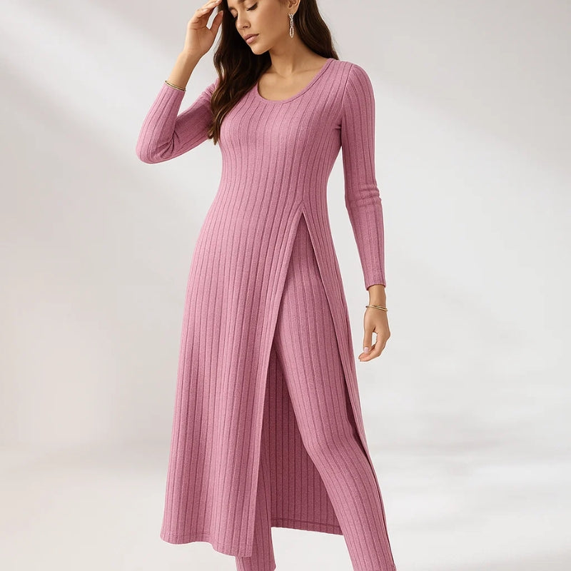 Women's ribbed knit two-piece lounge set in neutral tones with relaxed fit and split-hem top