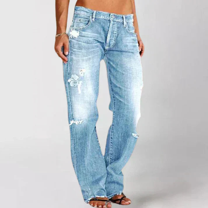 Women's relaxed fit mid-rise distressed denim jeans streetwear style with relaxed hip and thigh cut